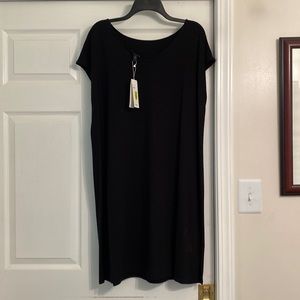 Very feminine Black Dress. A body- Slimming knit with polish for any occasion.